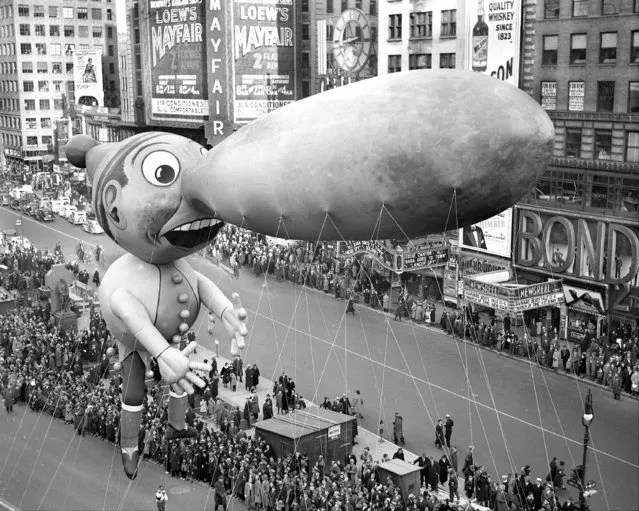 Balloons float down Broadway in thirteenth annual Macy's Thanksgiving Day parade, 1937. Seven musical organizations, twenty-one floats and balloon units and 400 costumed marchers participated in this year's merry cavalcade. All doubt as the existence of Santa Claus was dispelled. He Was There! (Photo by Walter Kelleher/NY Daily News Archive via Getty Images)