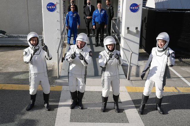 Astronauts, from left, Oleg Platonov, of Russia, Mike Fincke, Zena Cardman, and Kimiya Yui, of Japan, pose for a photo as they leave the Operations and Checkout Building for a trip the Kennedy Space Center's Launch Pad 39-A and a planned liftoff on a SpaceX Falcon 9 rocket Friday, August 1, 2025, in Cape Canaveral , Fla. (Photo by John Raoux/AP Photo)