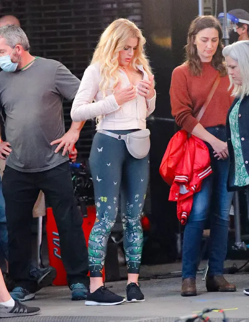 American actress Busy Philipps, American comedy writer Paula Pell and American singer-songwriter Sara Bareilles are seen on set of Tina Fey's “Girls5Eva” in New York City on October 22, 2020. Phillips, 41, was seen in costume wearing an off white leather jacket, grey fanny pack, patterned leggings, and black sneakers. (Photo by TheImageDirect.com)