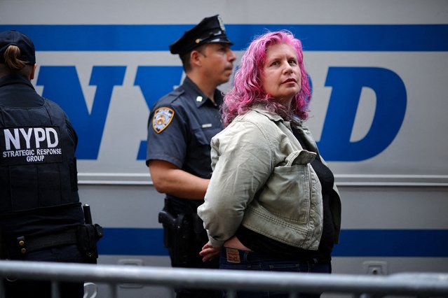 A demonstrator is detained by a police officer during a protest near the 80th United Nations General Assembly at the U.N. headquarters in New York City on September 23, 2025. (Photo by Carlos Barria/Reuters)