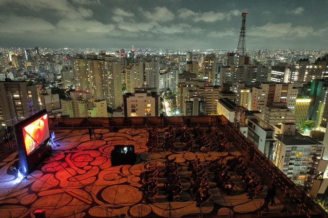 People watch “A Star Is Born” at an open-air movie theater on the rooftop of a shopping mall on Paulista Avenue in Sao Paulo, Saturday, August 30, 2025. (Photo by Andre Penner/AP Photo)