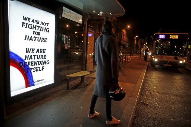 A poster by street artist Climate Games as part of the "Brandalism" project is displayed at a bus stop in Paris, France, November 28, 2015, ahead of the United Nations COP21 Climate Change conference in Paris. (Photo by Benoit Tessier/Reuters)