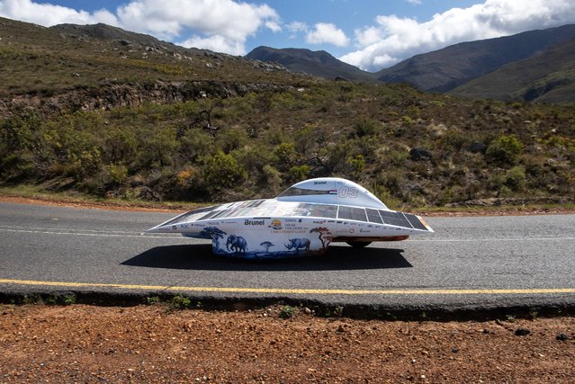 The solar powered car of the Brunel Solar Team from Holland, takes part in the 8th and the final day of the Sasol Solar Challenge near Franschhoek, about 70km from Cape Town, on September 20, 2024. The eight-day event sees international and South African teams with solar-powered cars, vying to rack up as much distance as they can on roads and loops between Pretoria and Cape Town. (Photo by Rodger Bosch/AFP Photo)