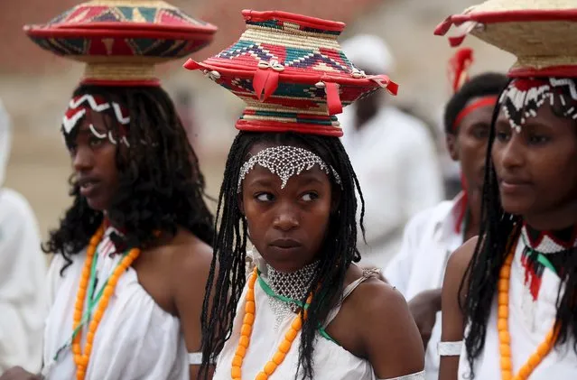 A cultural dance group from Oromiya region waits to perform at Gambela stadium during Ethiopia's Nations and Nationalities Festival in Gambela town, in Ethiopia, December 9, 2015. (Photo by Tiksa Negeri/Reuters)