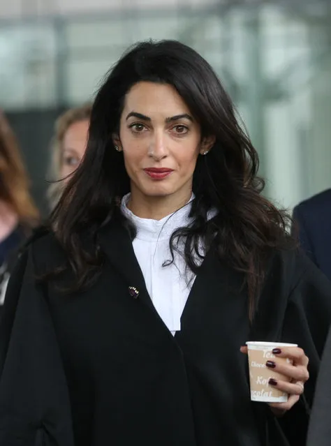 Amal Clooney, a member of a legal team representing Armenia, enjoys a coffee during a break at the European Court of Human rights in Strasbourg, eastern France, Wednesday, January 28, 2015. Amal Clooney, the wife of George Clooney, is among the lawyers arguing at the European Court of Human Rights against a Turkish man convicted in Switzerland for denying the 1915 Armenian genocide. (Photo by Christian Lutz/AP Photo)