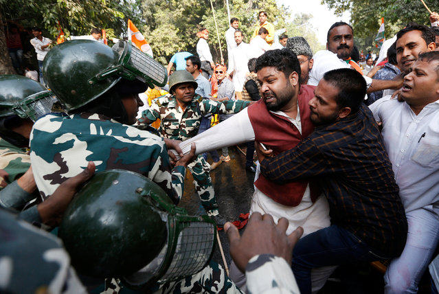 Police detain activists of the youth wing of India's main opposition Congress party during a protest against the government's decision to withdraw 500 and 1000 Indian rupee banknotes from circulation, according to a media release, in New Delhi, India, November 18, 2016. (Photo by Adnan Abidi/Reuters)