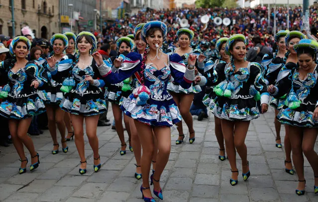 Women dance Caporal during the carnival in La Paz, Bolivia, Saturday, February 7, 2015. The Caporal dancers accompany fellow carnival characters Chuta, Pepino and Chola who represent gaiety and never tire of dancing. (Photo by Juan Karita/AP Photo)