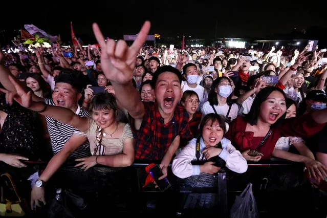 Fans attend a performance of a rock band at the Strawberry Music Festival during Labour Day holiday in Wuhan, Hubei Province, China on May 1, 2021. (Photo by Tingshu Wang/Reuters)