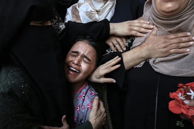 Mourners react during the funeral of Palestinian Majdi Ghabayen, who died of wounds sustained in an explosion during a rally near the border fence with Israel on September 13, in Beit Lahia in the northern Gaza Strip on September 25, 2023. (Photo by Mahmud Hams/AFP Photo)