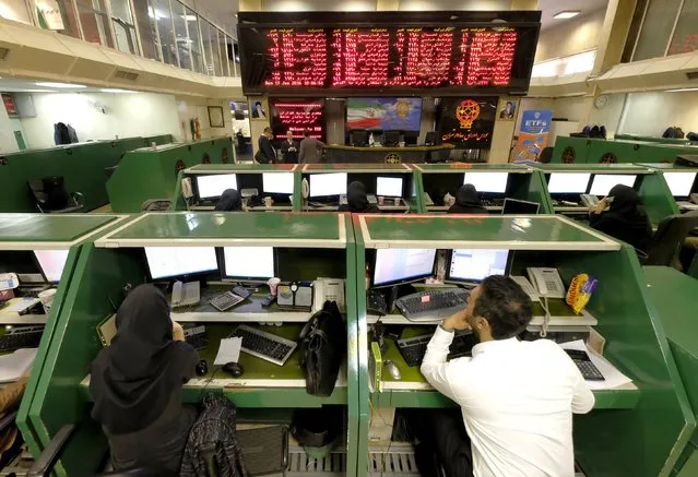 Stock market employees work at Tehran's Stock Exchange, Iran, January 17, 2016. (Photo by Raheb Homavandi/Reuters/TIMA)