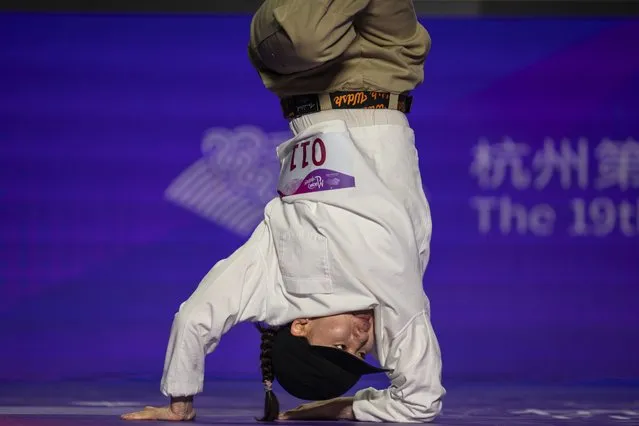 Mongolia's Khandjav Myagmarjav competes during the women's pre-selection for breakdancing at the 19th Asian Games in Hangzhou, China, Friday, October 6, 2023. (Photo by Louise Delmotte/AP Photo)