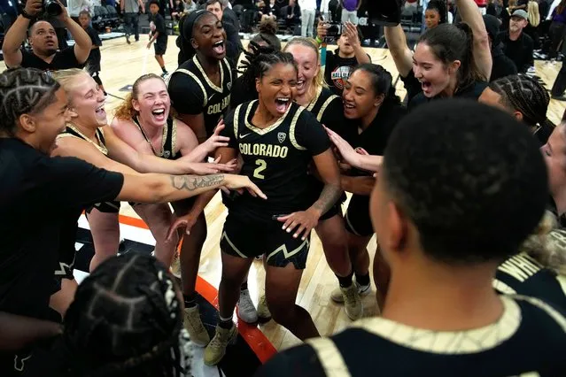 Colorado players celebrate after defeating LSU in an NCAA college basketball game Monday, November 6, 2023, in Las Vegas. (Photo by John Locher/AP Photo)