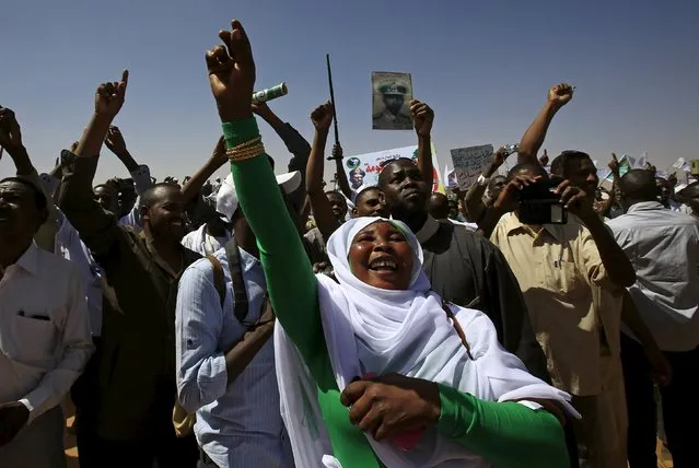 Supporters of the National Congress Party's (NCP) presidential candidate, Sudan's President Omar Hassan al-Bashir wave as they gather during a campaign rally at Al Fashir in North Darfur, ahead of the 2015 elections, April 8, 2015. (Photo by Mohamed Nureldin Abdallah/Reuters)