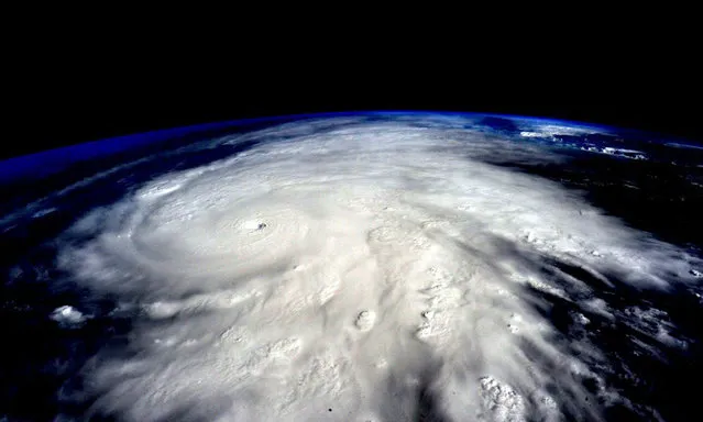 Astronaut Scott Kelly posted this photo taken from the International Space Station October 23, 2015 on Twitter with the caption, “Hurricane #Patricia approaches #Mexico. It's massive. Be careful! #YearInSpace”. (Photo by Scott Kelly/NASA)