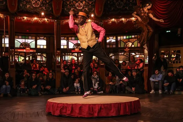 French tap dancer “Philou” performs a demonstration of Charleston dance during the 13th edition of the “Festival du Merveilleux” (Festival of the Marvelous) in Paris, France, 27 December 2023. The Museum of Fairground Arts gathers the largest private collection dedicated to the show and the fairground art from 1850 to 1930. Since 2009, the museum has been offering different events during the festival to recreate the fun and entertainment of the late 19th and early 20th century. This year's edition of the Festival du Merveilleux, running from 27 December 2023 to 07 January 2024, highlights the link between the Belle Epoque funfair and sporting activities. (Photo by Teresa Suarez/EPA/EFE)