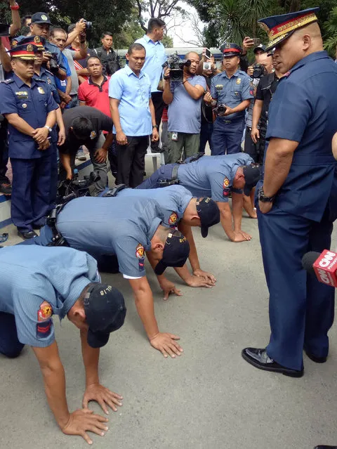 Philippine National Police chief General Ronald Dela Rosa asks policemen involved in the extortion of Korean nationals, to do push-ups as a punishment,  in Angeles city, Pampanga in northern Philippines February 1, 2017. (Photo by Jess Malabanan/Reuters)