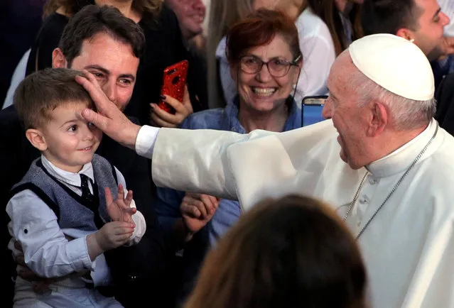Pope Francis blesses a child during the meeting with Bulgarian Catholic community at St Michael the Archangel church in Rakovski, Bulgaria on May 6, 2019. (Photo by Stoyan Nenov/Reuters)