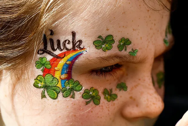 A girl with her face painted attends the St. Patrick's Day parade in Dublin, Ireland on March 17, 2024. (Photo by Clodagh Kilcoyne/Reuters)