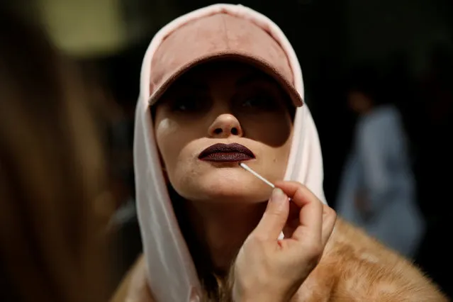 A model presenting a creation from Jesus Lorenzo's Fall/Winter 2017 collection gets made up during the Mercedes-Benz Fashion Week in Madrid, Spain February 20, 2017. (Photo by Susana Vera/Reuters)