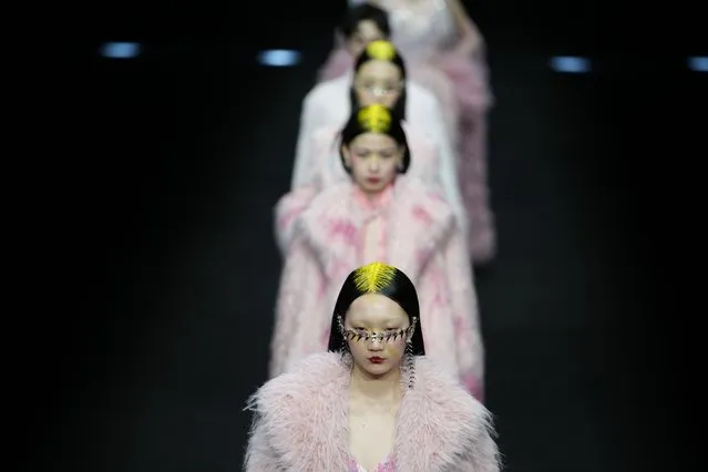 Models display creations by Moe Ho by Mengmeng He, during China Fashion Week in Beijing, Friday, March 29, 2024. (Photo by Ng Han Guan/AP Photo)