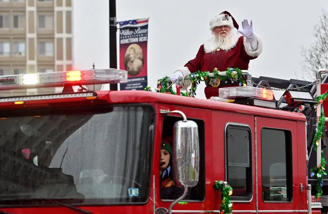 Santa arrives at Public Square on the Wilkes-Barre Ladder Truck in Wilkes-Barre, US on December 18, 2021. (Photo by Aimee Dilger/SOPA Images/Rex Features/Shutterstock)
