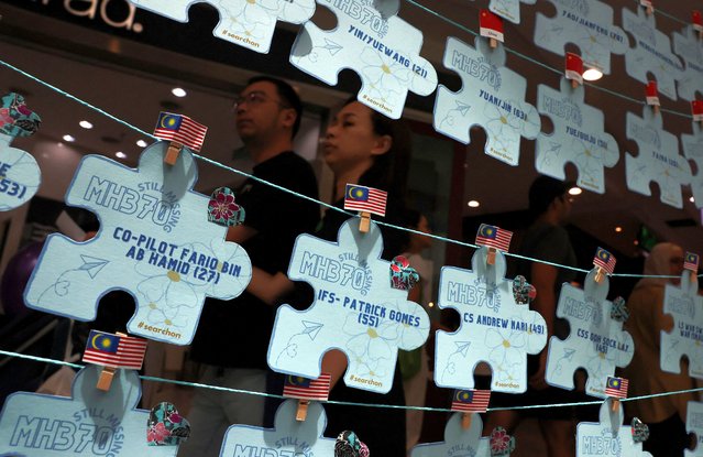 Names of crew members and passengers of the missing Malaysia Airlines flight MH370 are displayed during a remembrance event marking the 10th anniversary of its disappearance, in Subang Jaya, Malaysia on March 3, 2024. (Photo by Hasnoor Hussain/Reuters)