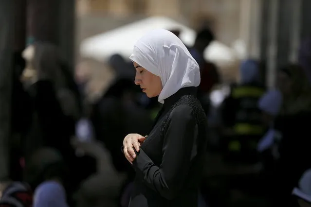 A Palestinian woman prays on the fourth Friday of the holy month of Ramadan at the compound known to Muslims as the Noble Sanctuary and to Jews as Temple Mount, in Jerusalem's Old City July 10, 2015. (Photo by Ammar Awad/Reuters)