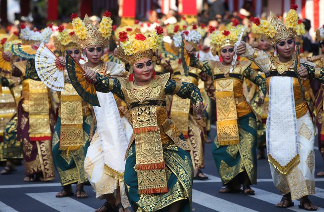 Women dancers perform during a parade at the opening of the Bali arts festival in Denpasar, Bali, Indonesia on Saturday, June 15, 2024. (Photo by Firdia Lisnawati/AP Photo)