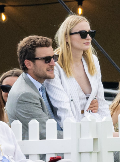 English-American actress Sophie Turner dazzles in a Louis Vuitton Nautical Double Breasted Pinstripe Blazer and Tailored Pinstripe Playsuit, accessorized with a gold belt and Louis Vuitton Knot pumps, as she presents prizes at Cowdray Park on July 20, 2024. (Photo by Splash News and Pictures)