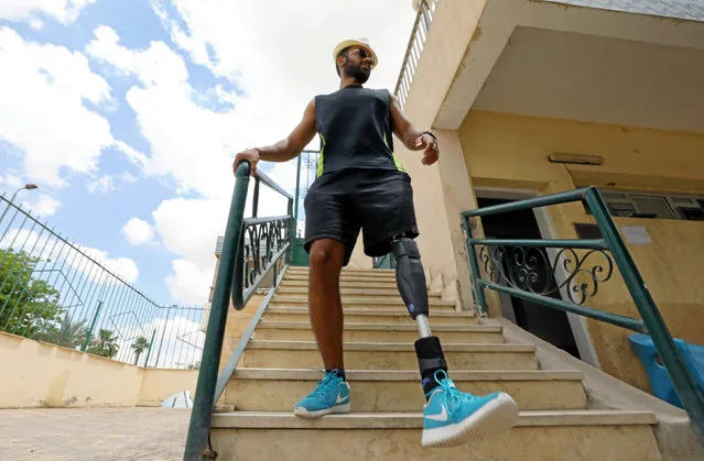 Egyptian swimmer Omar Hegazy, who is the first one-legged man to swim across the Gulf of Aqaba from Egypt to Jordan, goes down some stairs after training in Cairo, Egypt May 20, 2017. (Photo by Mohamed Abd El Ghany/Reuters)