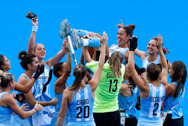 Rocio Sanchez Moccia of Argentina is thrown in the air by her teammates while celebrating winning the women's hockey bronze medal match between Argentina and Belgium on day fourteen of the Olympic Games Paris 2024 at Stade Yves Du Manoir on August 09, 2024 in Paris, France. (Photo by Anushree Fadnavis/Reuters)