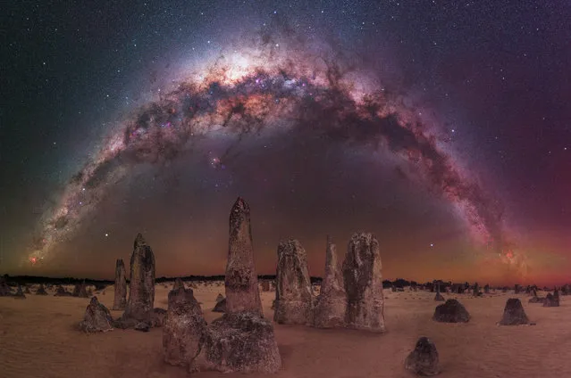 The Milky Way arching over The Pinnacles Desert – Nambung National Park, Australia. “This is a 180-degree panorama of the Milky Way as it begins to set towards the western horizon at The Pinnacles Desert, two hours north of Perth in Western Australia. The Pinnacles are such an amazing location for astrophotography. The area is littered with thousands of these limestone monoliths, which means that composition possibilities are almost endless and one of the reasons I keep coming back here year after year”. (Photo by Daniel Zafra Portill/Milky Way Photographer of the Year)