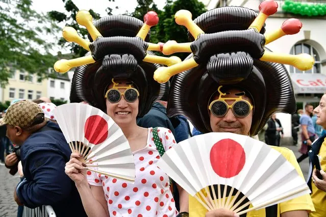 Disguised supporters are pictured during the 203,5 km second stage of the 104th edition of the Tour de France cycling race on July 2, 2017 between Dusseldorf, Germany and Liege, Belgium. (Photo by Philippe Lopez/AFP Photo)