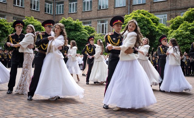 Graduate cadets dance to mark their last day at the military lyceum in Kyiv, Ukraine, Tuesday, June 13, 2023. (Photo by Efrem Lukatsky/AP Photo)