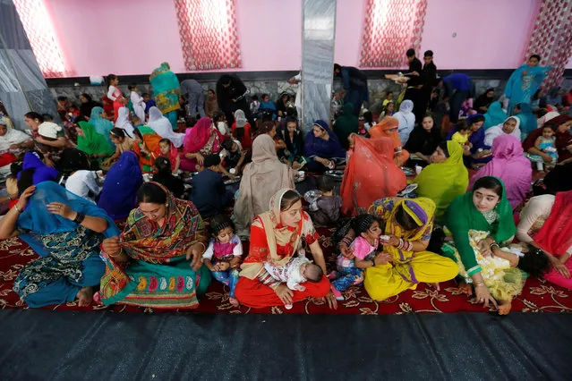 Afghan Hindu and Sikh families wait for lunch inside a Gurudwara, or a Sikh temple, during a religious ceremony in Kabul, Afghanistan June 8, 2016. (Photo by Mohammad Ismail/Reuters)