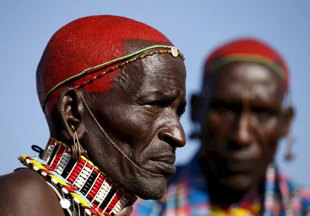 Samburu tribesmen stand during the Maralal Camel Derby, Kenya, August 15, 2015. (Photo by Goran Tomasevic/Reuters)