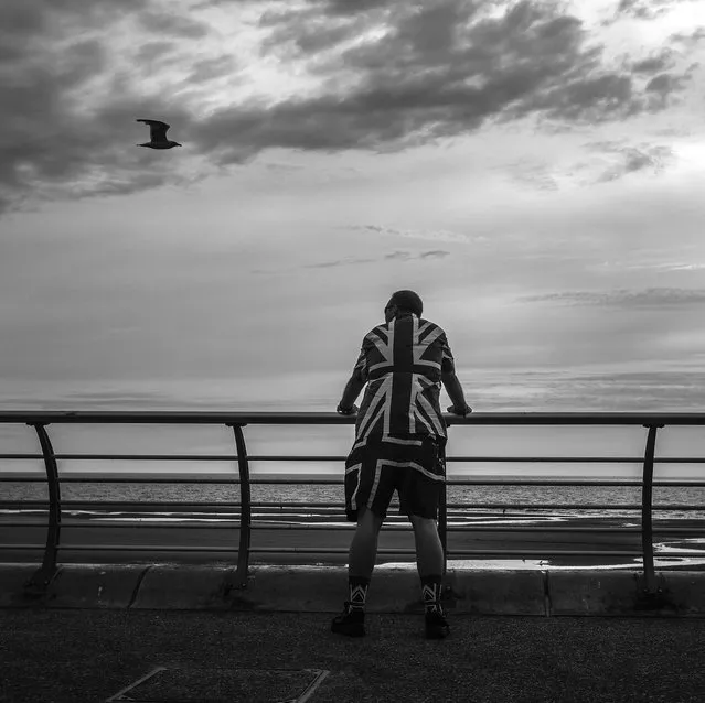 A Punk Rocker relaxes looking out to sea as punks gather in Blackpool for the annual Rebellion Punk Rock Festival in Blackpool. (Photo by Christopher Furlong/Getty Images)