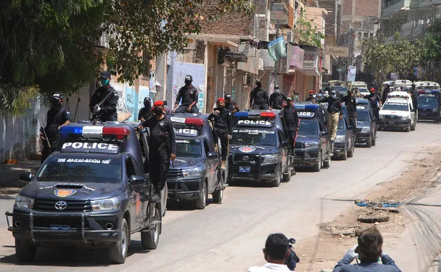 Police vehicles patrol during a government-imposed nationwide lockdown to try to contain the coronavirus, in Hyderabad, Pakistan, Thursday, April 2, 2020. (Photo by Pervez Masih/AP Photo)