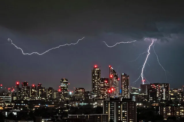 Lightning strikes over London on May 18, 2022, as yellow weather warnings are issued for southern England by the Met Office during the ongoing heatwave week. (Photo by Guy Corbishley/Alamy Live News)