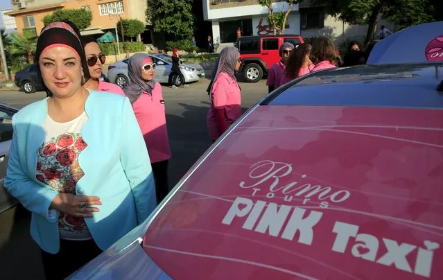 Reem Fawzy (L), the director of the Pink Taxi company stands in a parking lot with women drivers in Cairo, Egypt, September 6, 2015. (Photo by Amr Abdallah Dalsh/Reuters)