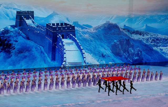 Members of the Chinese military march with a flag of China during the opening ceremony of the Asian Winter Games in Harbin, China on February 7, 2025. (Photo by Issei Kato/Reuters)