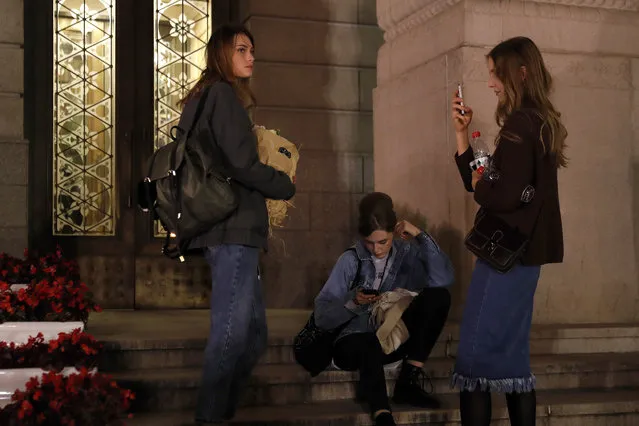 Russian models take a rest outside a Beijing hotel after taking part in a fashion show during the China Fashion Week in Beijing, Monday, October 30, 2017. A Chinese modeling agency that hired a 14-year-old Russian girl is denying media reports that a “slave contract” contributed to the teen's sudden death. The exact circumstances of Vlada Dzyuba's death last week are still murky, and there are conflicting accounts from Russia and China. (Photo by Andy Wong/AP Photo)