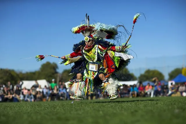 A reveller dances during a "pow-wow" celebrating the Indigenous Peoples' Day Festival in Randalls Island, New York, October 11, 2015. (Photo by Eduardo Munoz/Reuters)