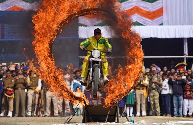 An Assamese policeman performs a stunt on his motorcycle during the Republic Day parade in Guwahati, India January 26, 2018. (Photo by Anuwar Hazarika/Reuters)