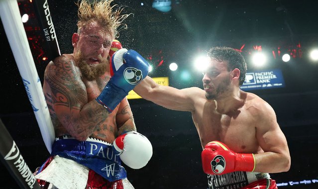 USA's Jake Paul (L) and Mexico's Julio Cesar Chavez Jr. fight during their cruiserweight boxing bout at the Honda Center in Anaheim, California, on June 28, 2025. (Photo by Patrick T. Fallon/AFP Photo)