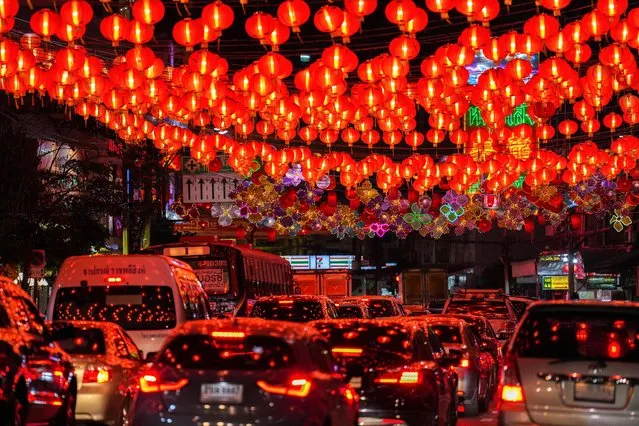 A view shows traffic under a street decorated by red lanterns ahead of Lunar New Year celebrations in Bangkokss Chinatown, Thailand on January 19, 2023. (Photo by Athit Perawongmetha/Reuters)