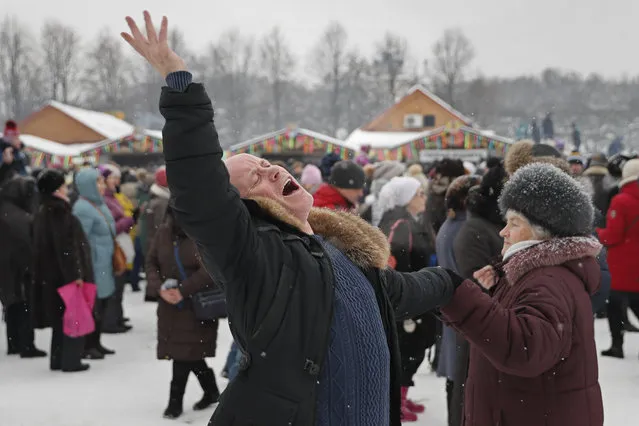 Russian people dancing during the Maslenitsa celebration, marking the end of winter in Moscow, Russia, 18 February 2018. Maslenitsa is a Slavic tradition that dates back to pagan times. (Photo by Yuri Kochetkov/EPA/EFE)