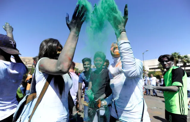 Participants throw coloured powder as they celebrate during “I Love Damascus” marathon at Umayyad Square in Damascus, Syria October 7, 2016. (Photo by Omar Sanadiki/Reuters)