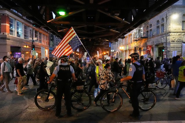 Police officers block a street as demonstrators march at a protest opposing “Operation Midway Blitz” and the presence of ICE, Tuesday, September 9, 2025, in Chicago. (Photo by Erin Hooley/AP Photo)