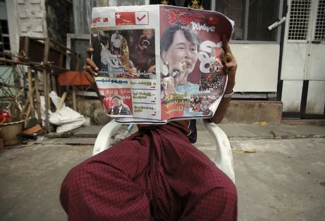 A man reads the newspaper outside his home in Yangon in this April 1, 2012 file photo. Anyone reading Myanmar's independent media ahead of the historic election on November 8, 2015, might be unaware over 90 political parties are competing, as online platforms and newspapers are plastered with the image of one candidate - Nobel laureate Aung San Suu Kyi. (Photo by Reuters/Staff)